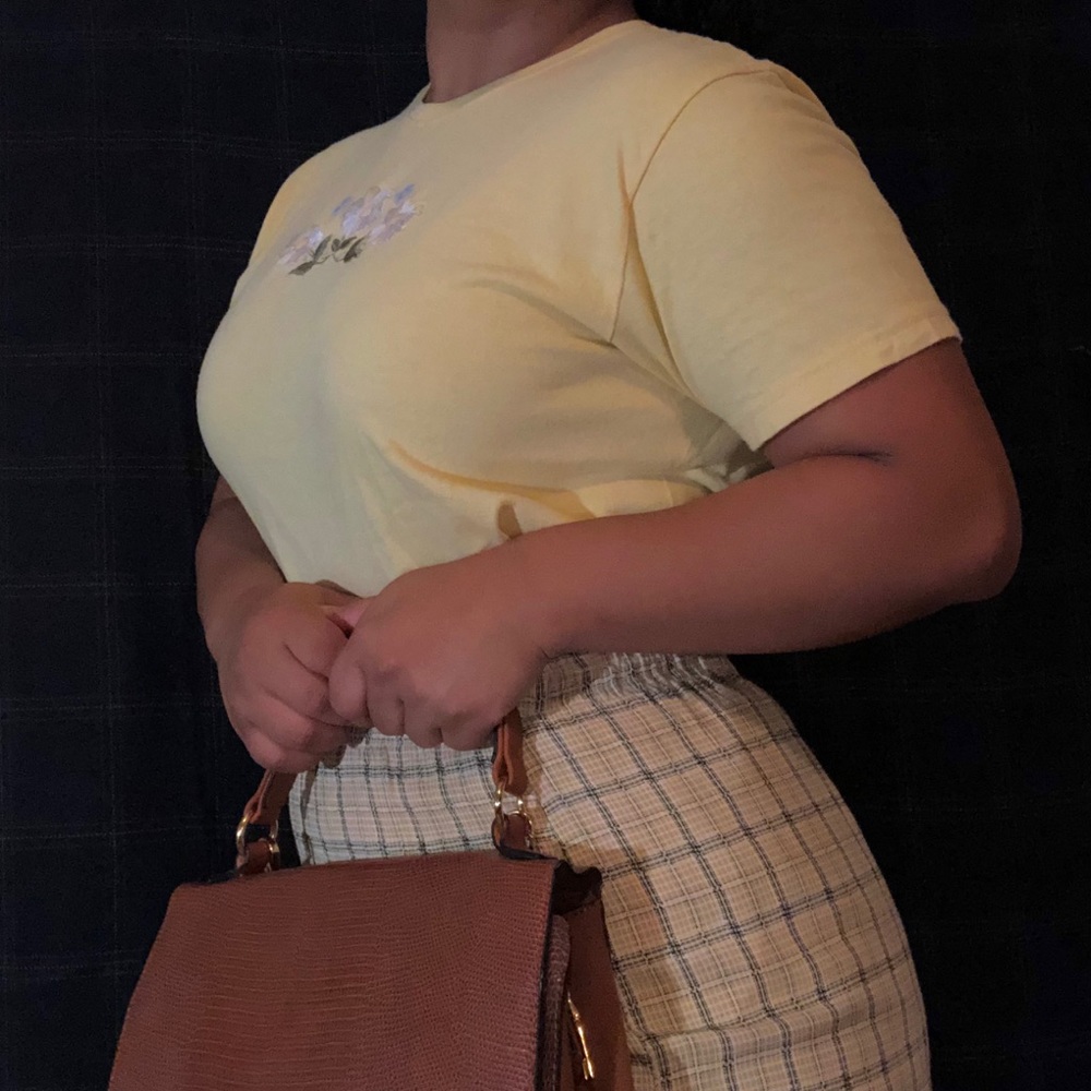 Yellow Hanes tee, embroidered flowers.